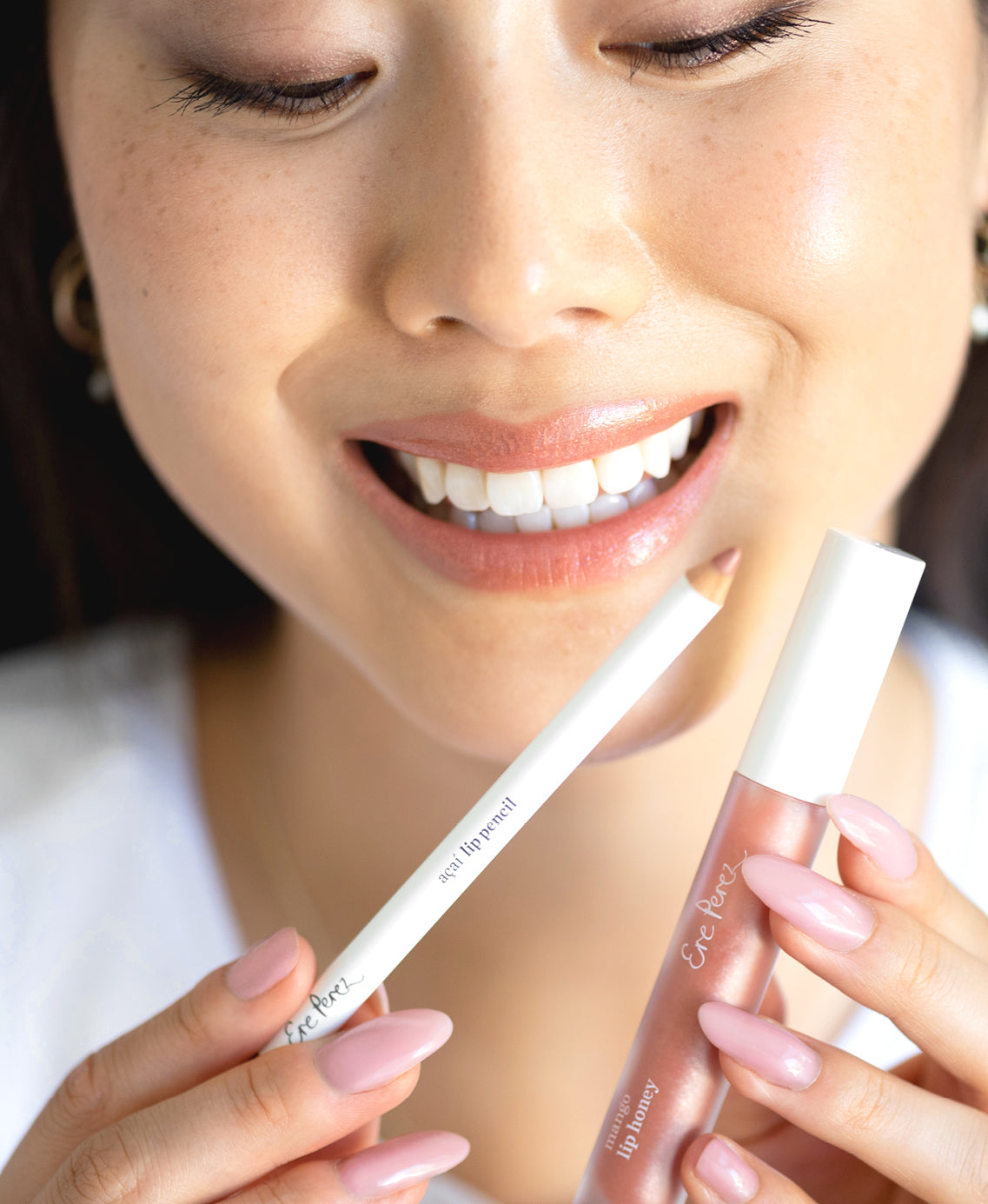 all-natural açai lip liner by Ere Perez in its pencil and applied to delicately line and hydrate lips