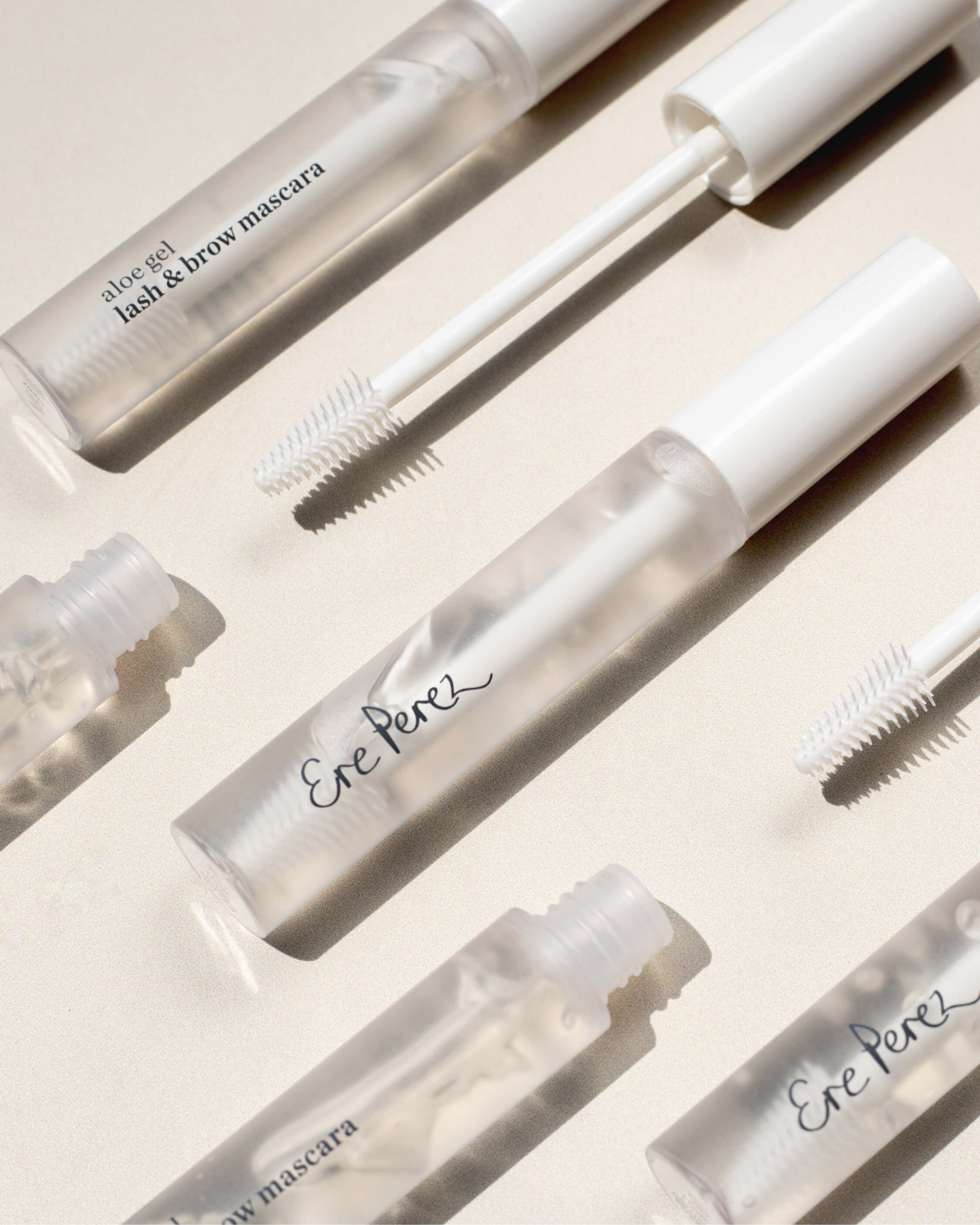 multiple bottles of aloe gel lash & brow mascaras by Ere Perez in their recyclable packaging