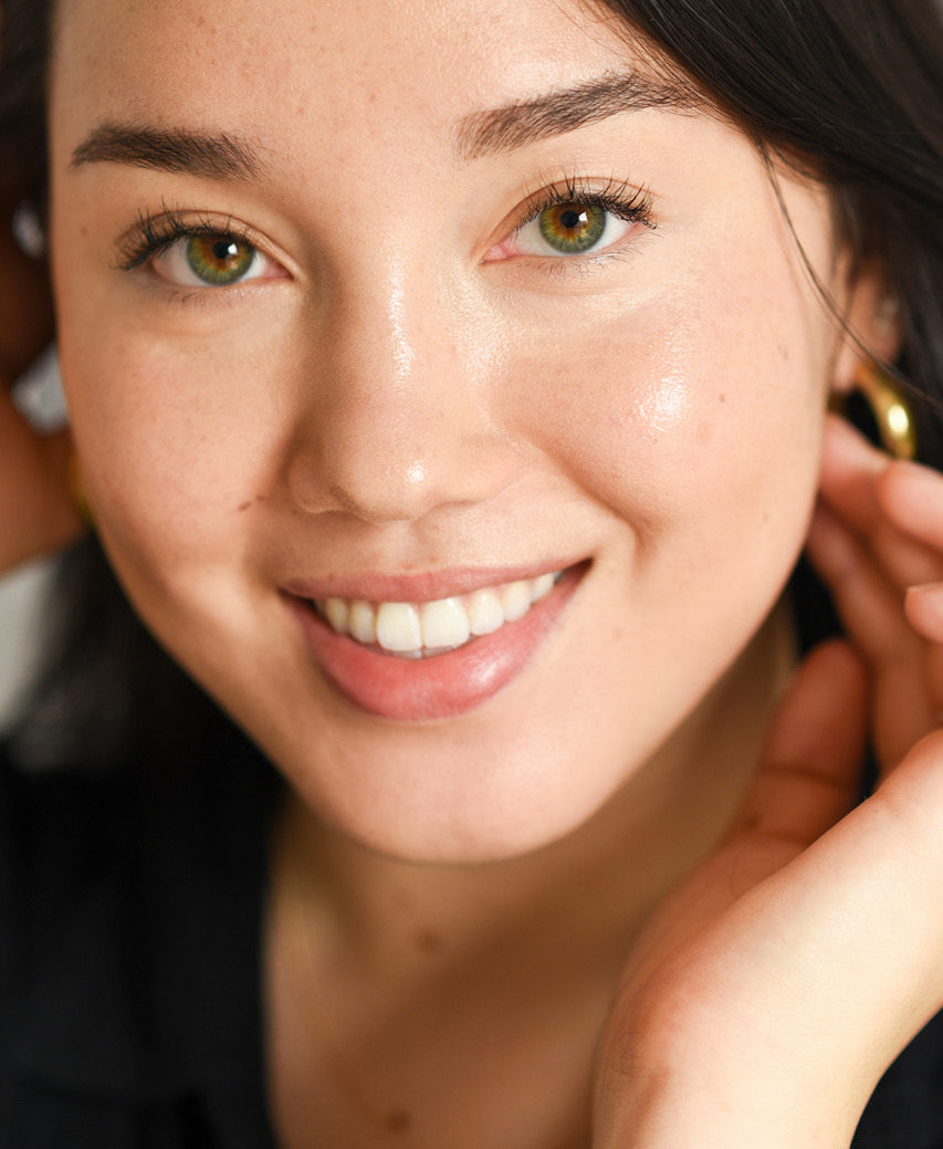 Nourishing, all-natural arnica concealer applied on skin for even complexion