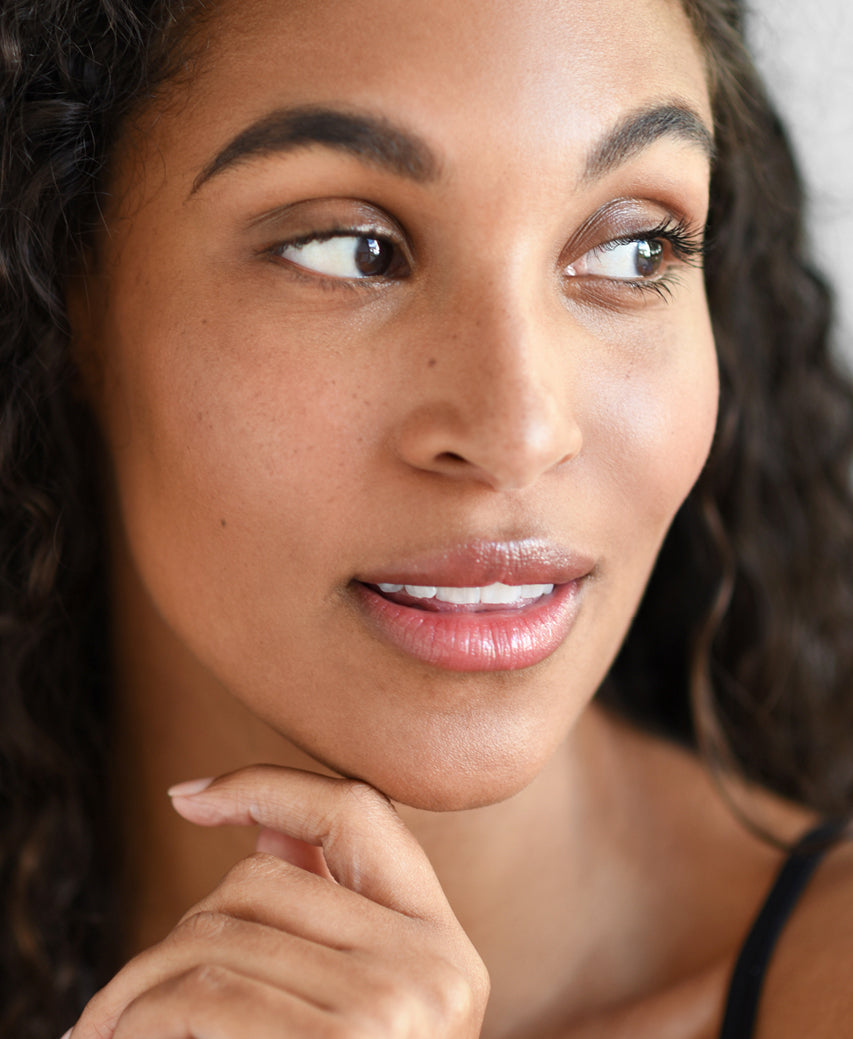 arnica all-cover delicate and organic concealer applied to skin