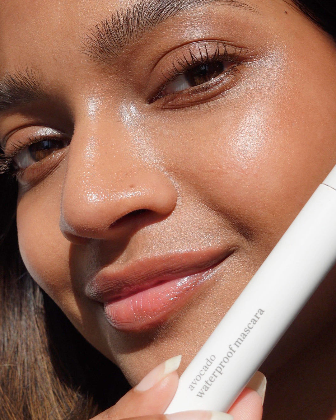 lash-growing clean avocado waterproof mascara by Ere Perez in tube and applied on lashes for a lengthening effect