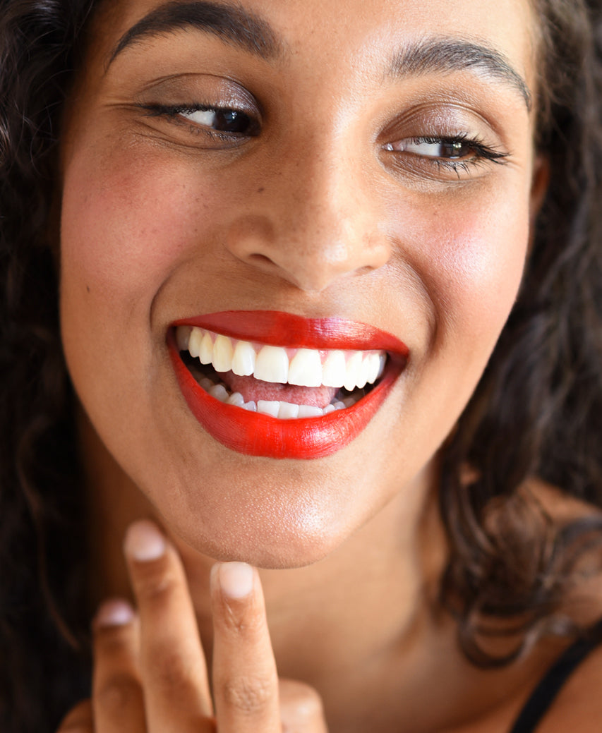 Ere Perez natural & plastic free beetroot cheek & lip tint worn on skin for a beautiful vibrant colour