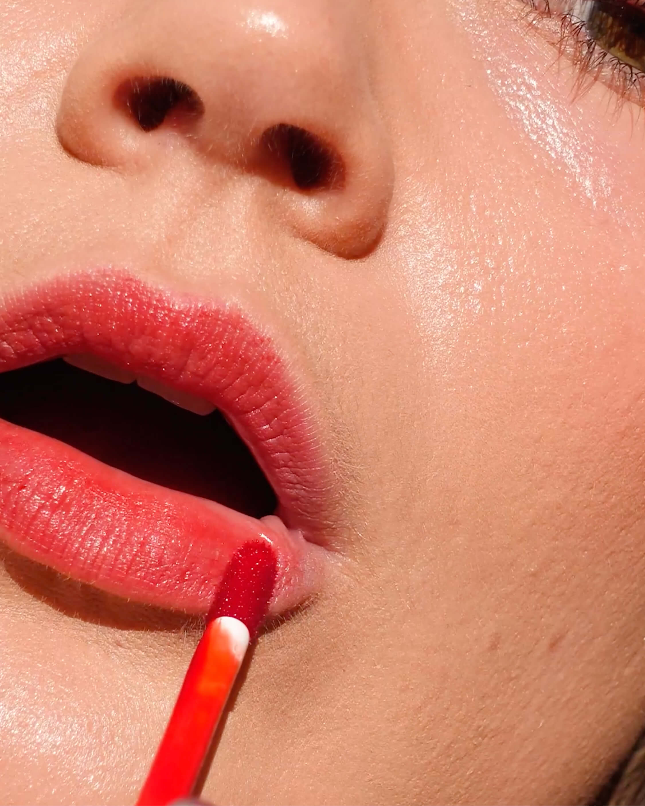 Ere Perez natural & plastic free beetroot cheek & lip tint worn on lips for a beautiful long-lasting red