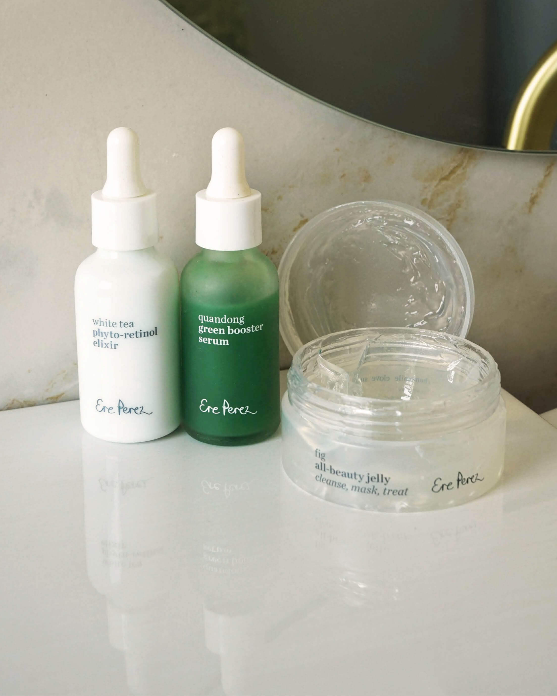 Clear skin set by Ere Perez, to clear acne naturally with a bottle of quandong green booster serum, a bottle of white tea photo-retinol elixir & a pot of fig all-beauty jelly