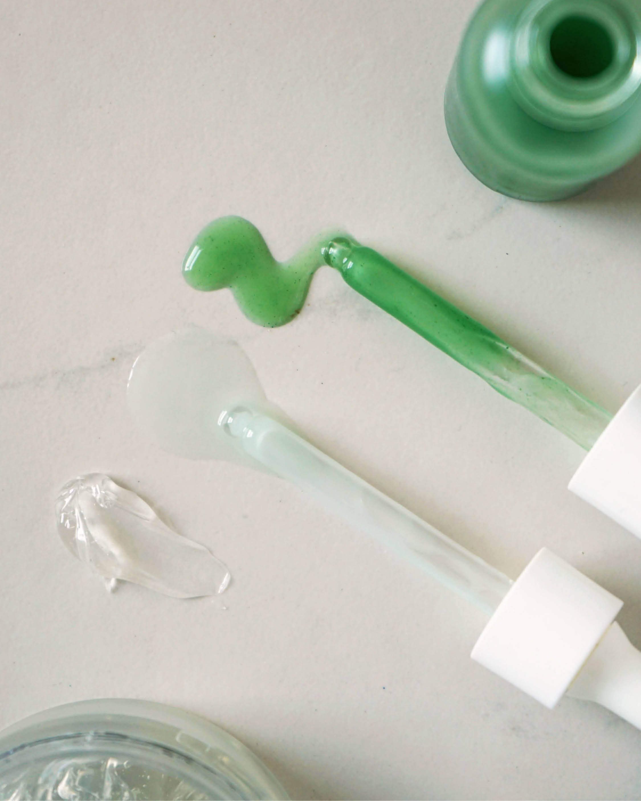 swatches of quandong green booster serum, white tea photo-retinol elixir & fig all-beauty jelly by Ere Perez