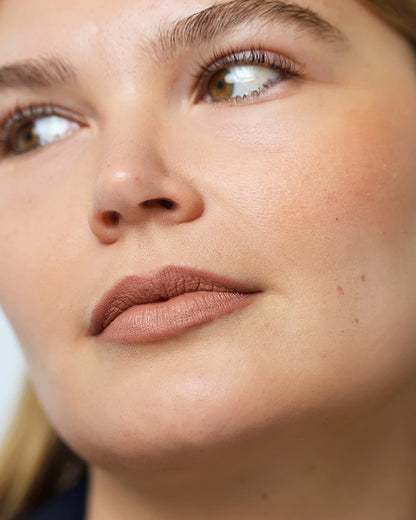 gentle moisturising coco crayon by Ere Perez applied on skin and in its waste-free crayon for a natural long-lasting colour