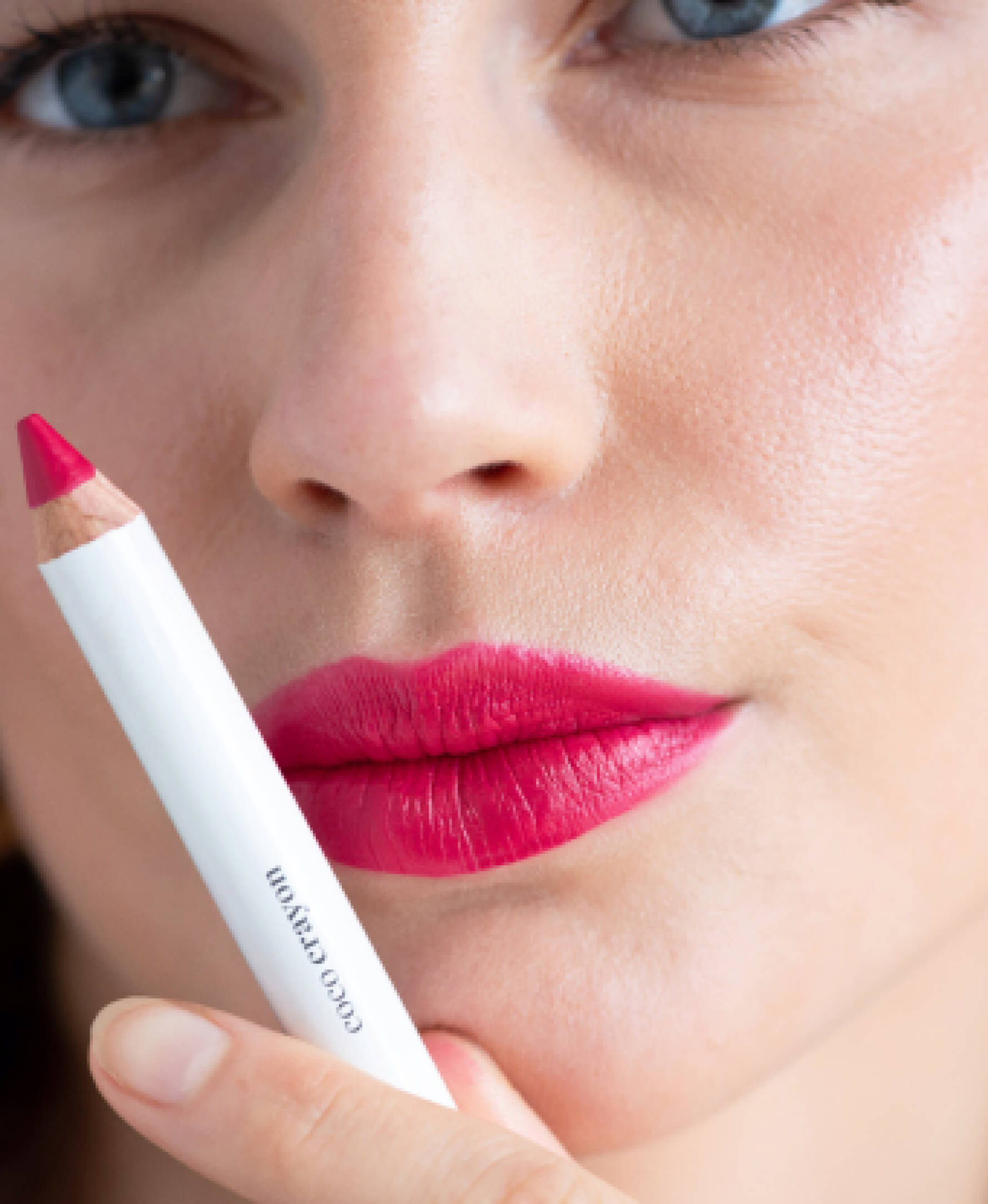 smooth hydrating coco crayon by Ere Perez applied on sensitive skin and in its plastic-free crayon for a vivid long-lasting colour