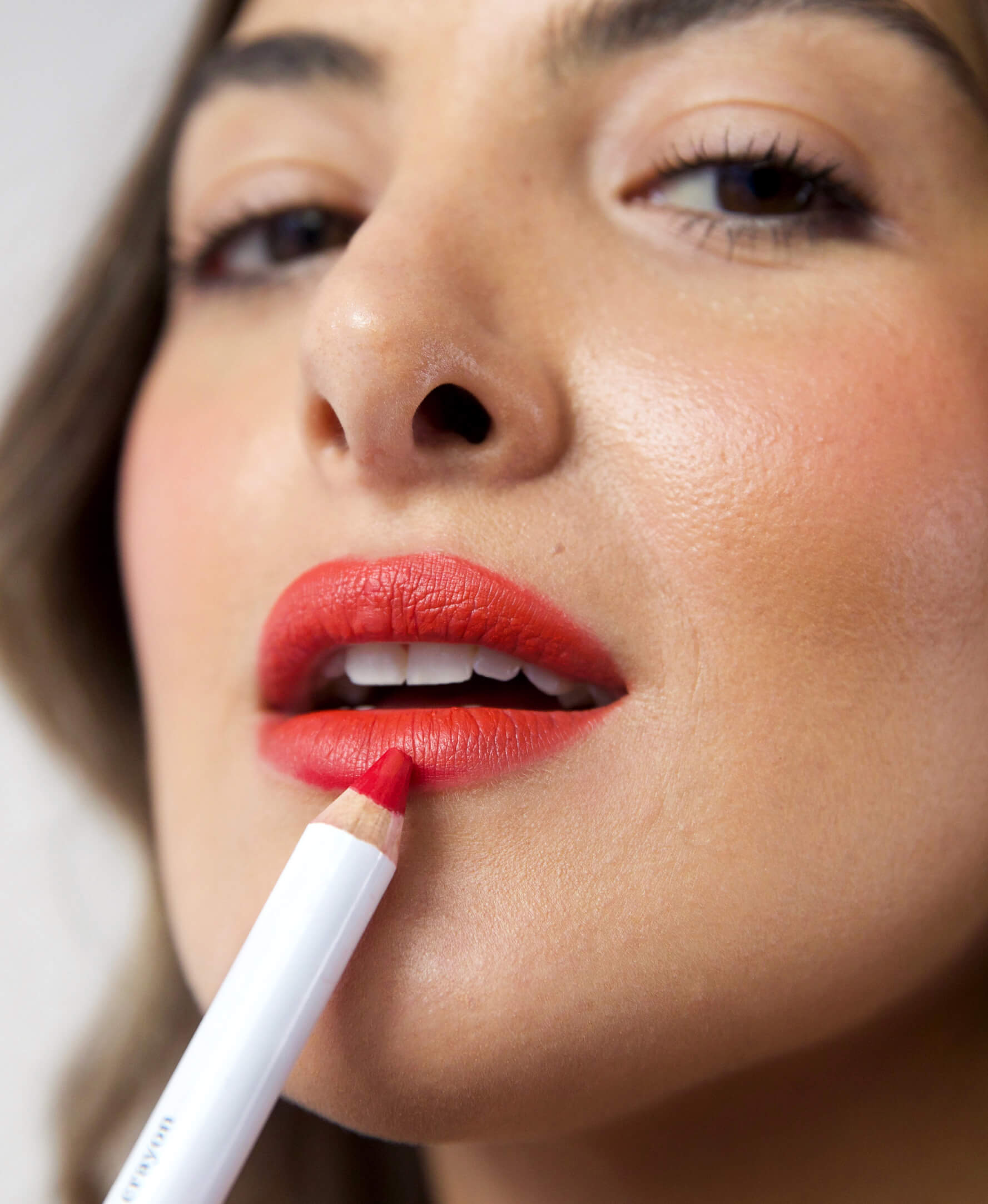 gentle hydrating coco crayon by Ere Perez applied on sensitive skin and in its waste-free crayon for a bold eco-responsible colour