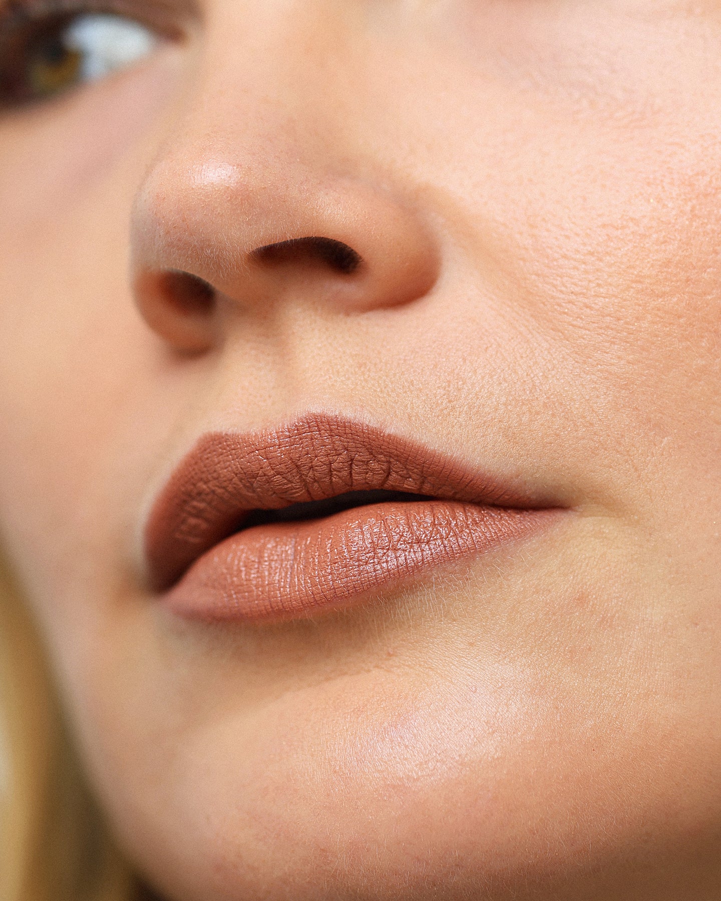 gentle moisturising coco crayon by Ere Perez applied on skin and in its waste-free crayon for a natural long-lasting colour