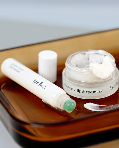 Ere Perez eye revival ritual, a combo of the natural grape water eye serum in its bottle and organic cranberry lip & eye mask