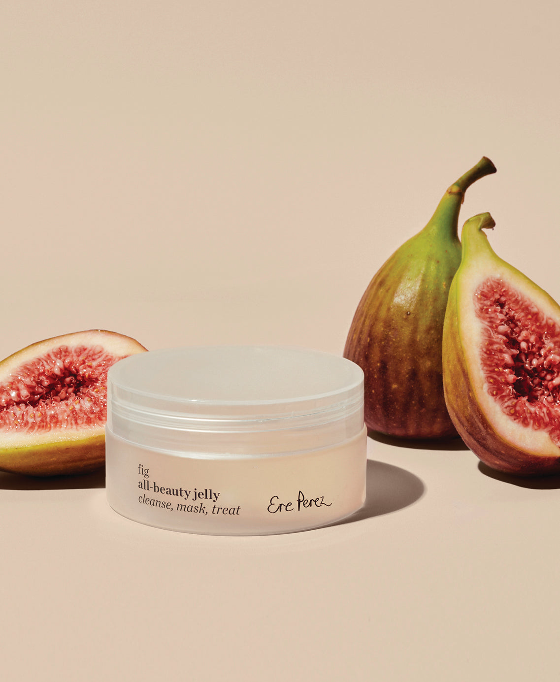 natural fig all-beauty jelly by Ere Perez next to its star ingredient: figs
