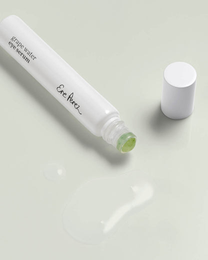 organic grape water eye serum in its infinitely recyclable eye roller and in clear swatch
