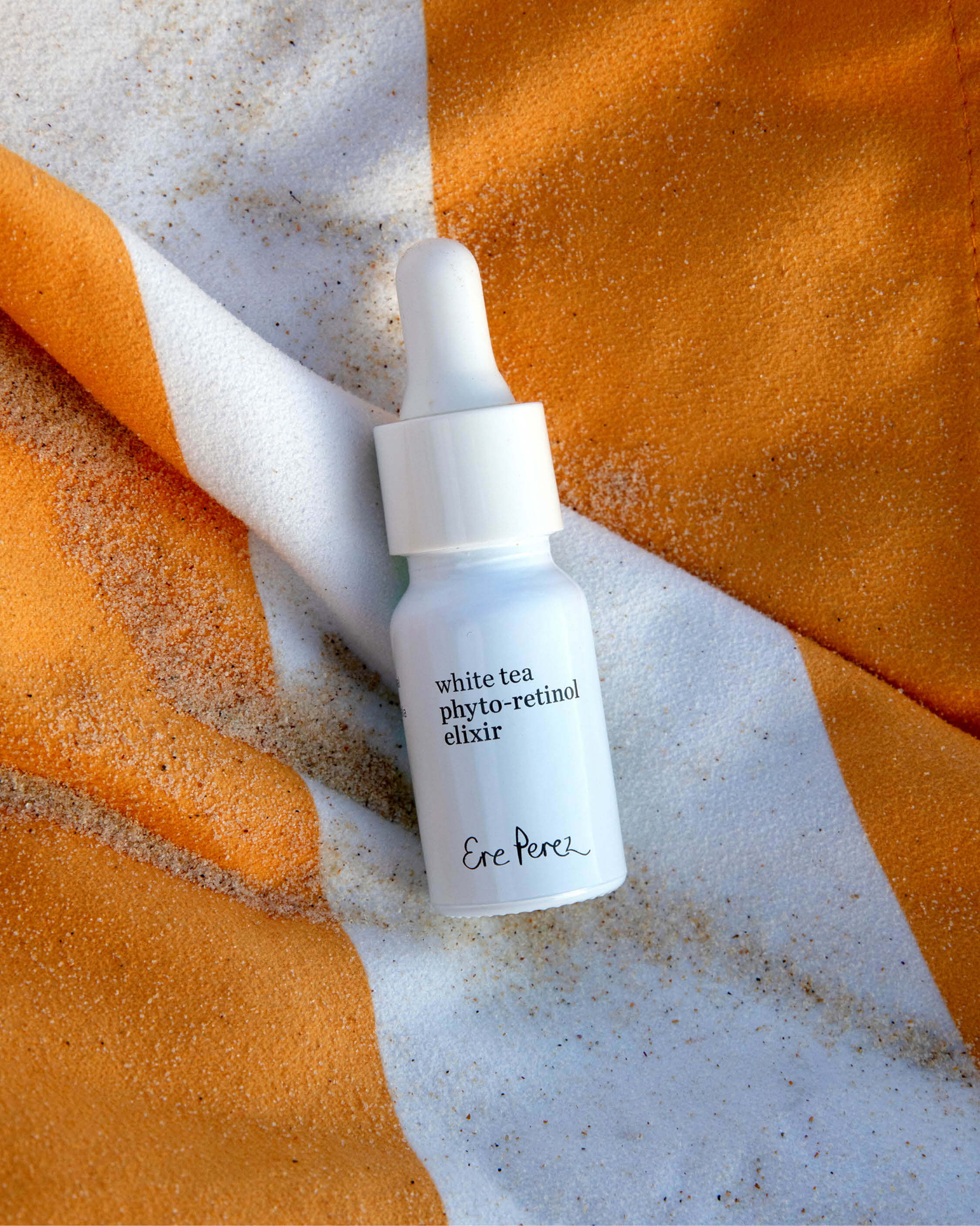 eco-friendly white tea phyto-retinol elixir in its glass packaging|