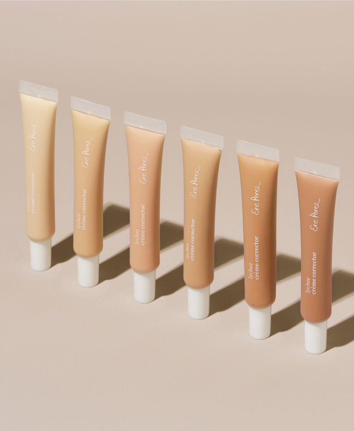 Bottles of various shades of natural & brightening lychee creme corrector by Ere Perez
