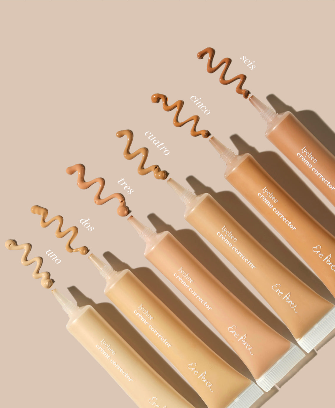Bottles and their creme of various shades of natural & brightening lychee creme corrector by Ere Perez