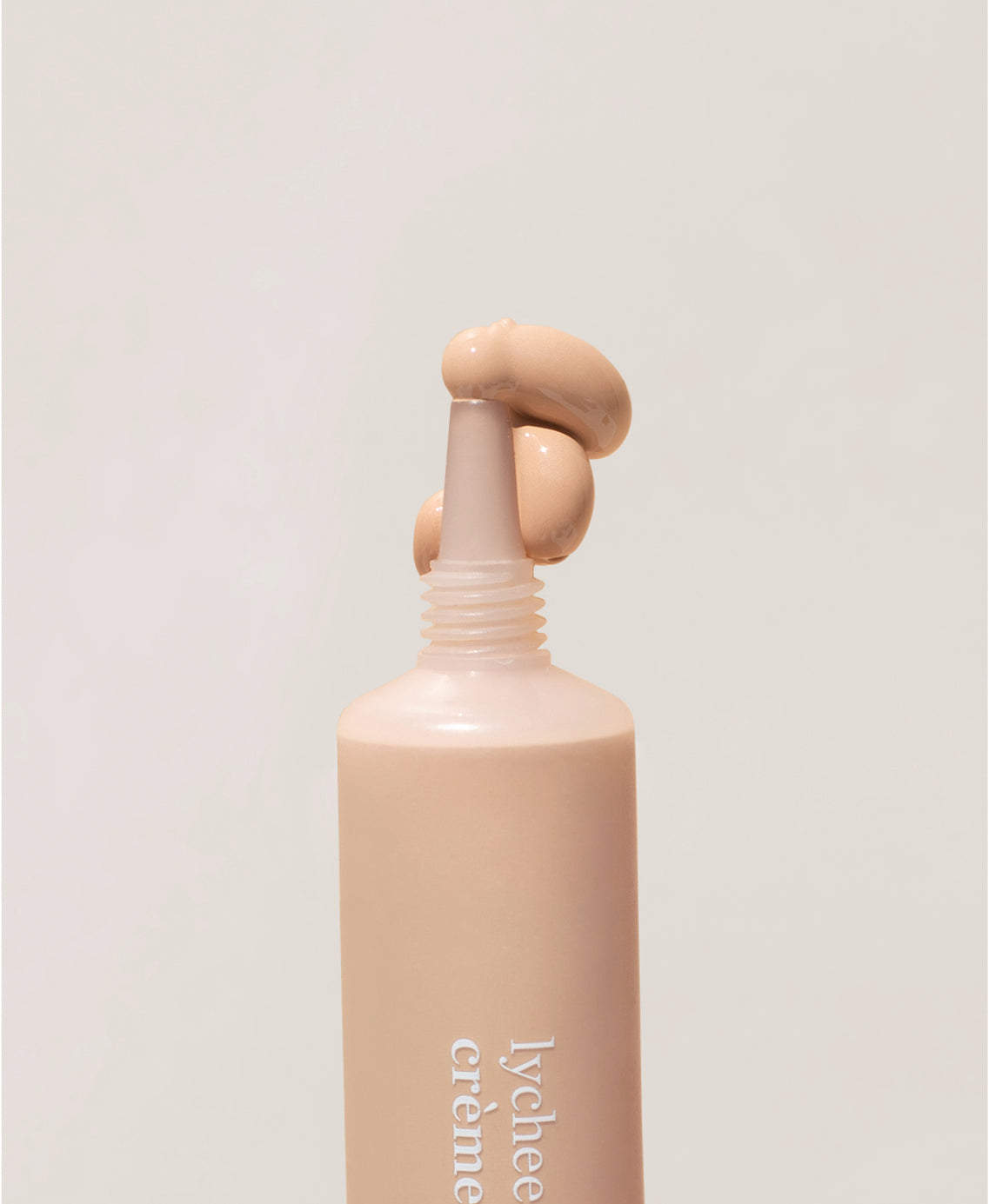 Bottle of organic lychee creme corrector and it&