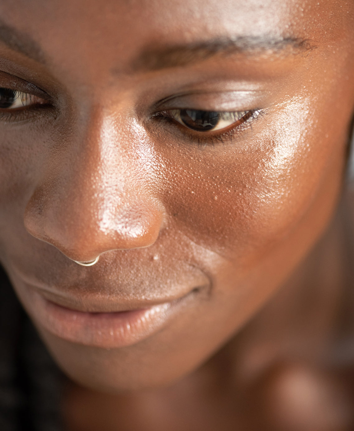 Organic lychee creme corrector by Ere Perez applied on skin for a bright clear complexion and moisturised skin