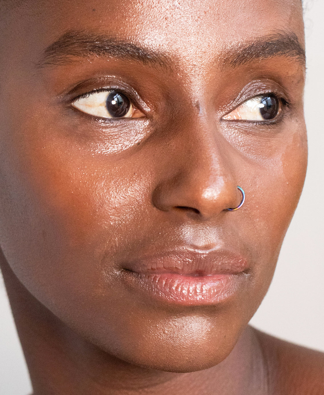 Organic lychee creme corrector applied on skin for a bright complexion and even covered skin