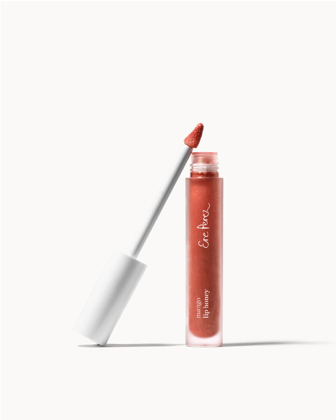 Organic mango lip gloss by Ere Perez in its tube