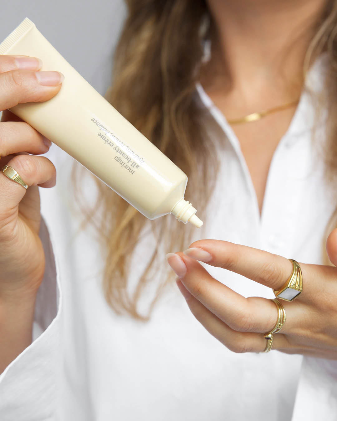 natural moringa all-beauty creme applied on the hands for fresh soft skin