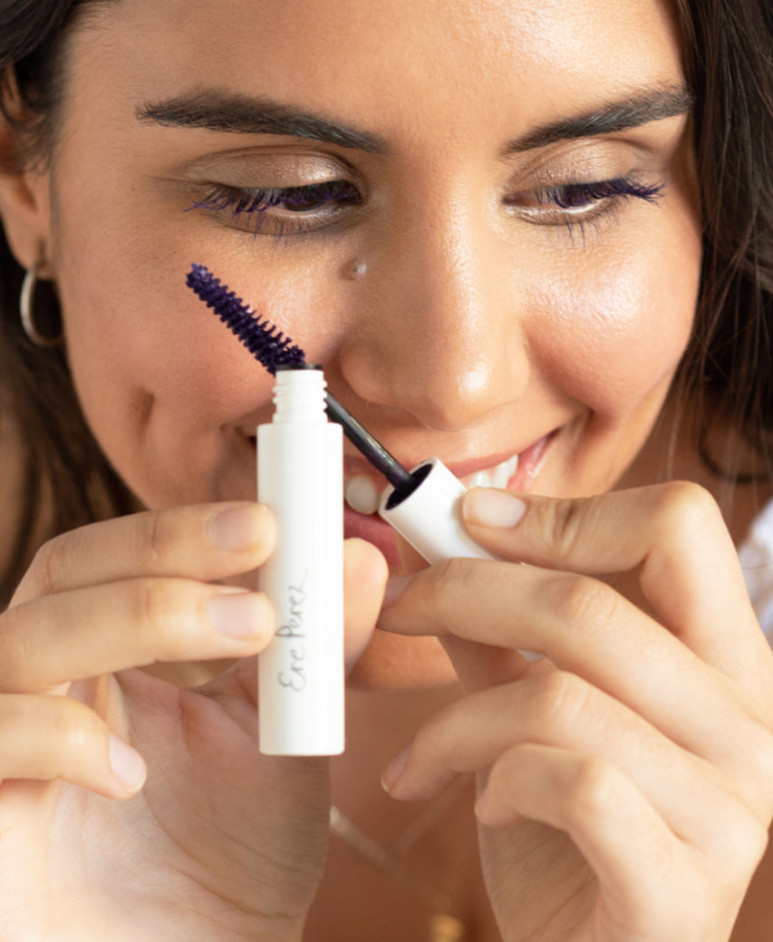 natural almond mascara by Ere Perez in its tube and applied on the eyes for a statement look