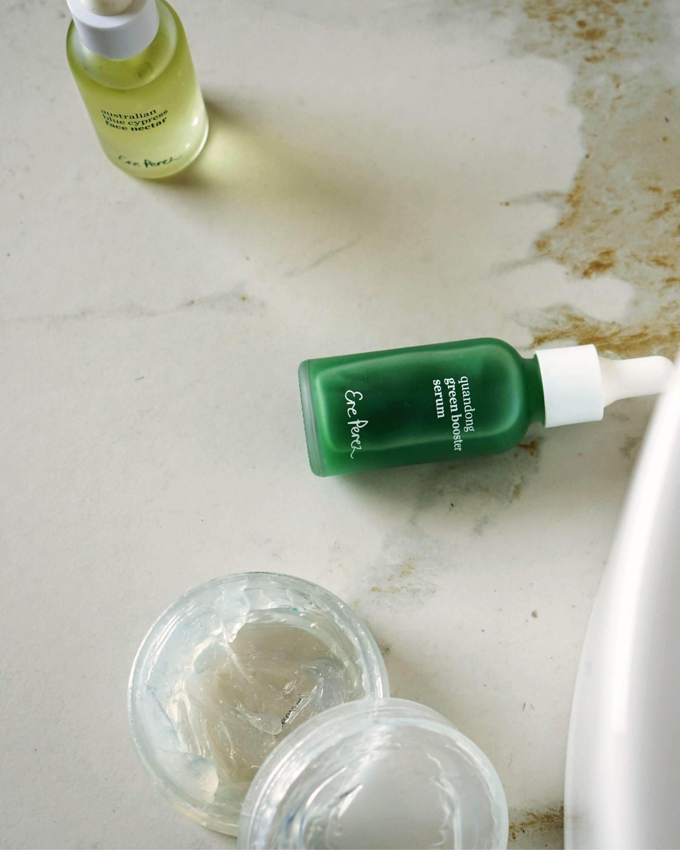 Natural discovery set combo by Ere Perez for your first skincare routine, with bottle of quandong green booster serum, bottle of Australian blue cypress face nectar and fig all beauty jelly