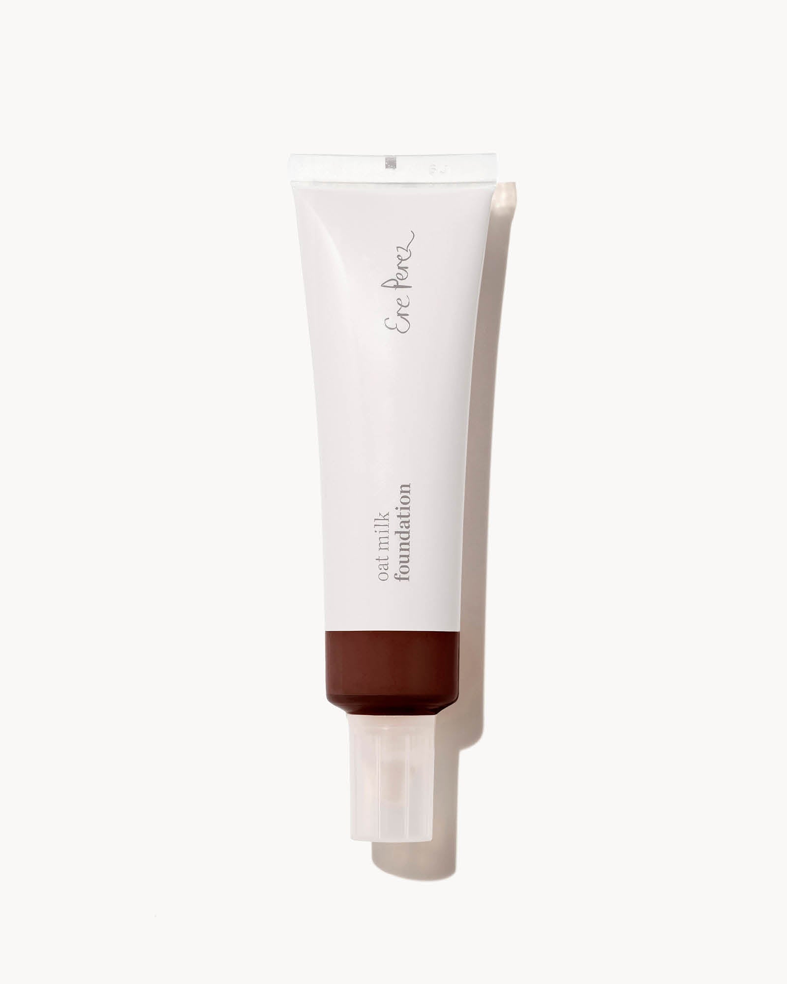 Tube of foundation in shade espresso with visible brand name on a white background