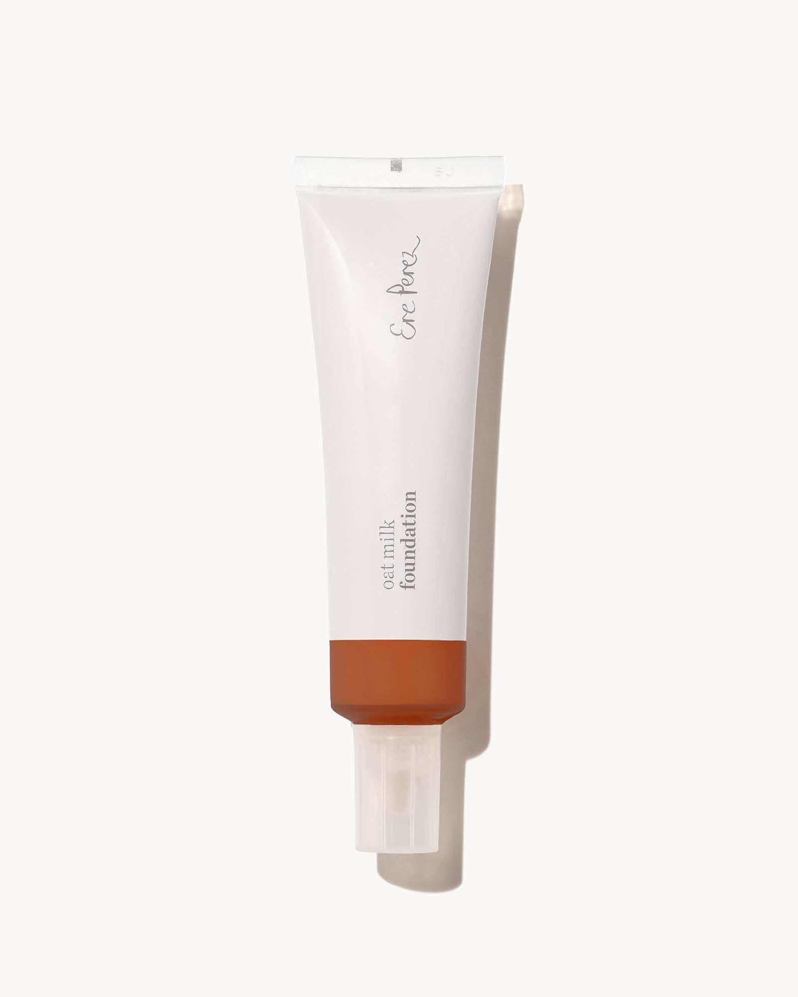 Foundation tube in the shade mocha with a white cap on a white background
