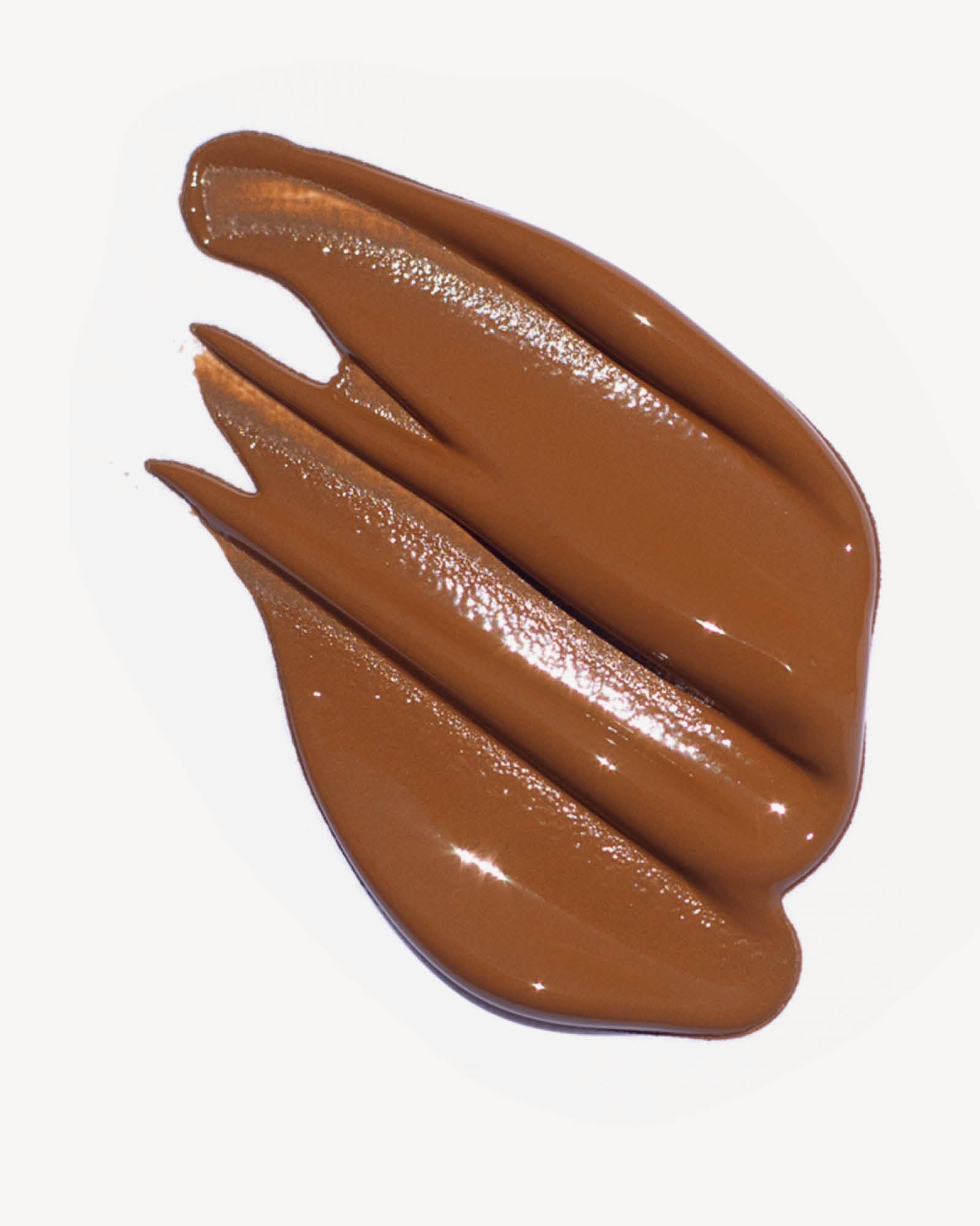 Oat Milk Foundation swatch in shade mocha on a white background,