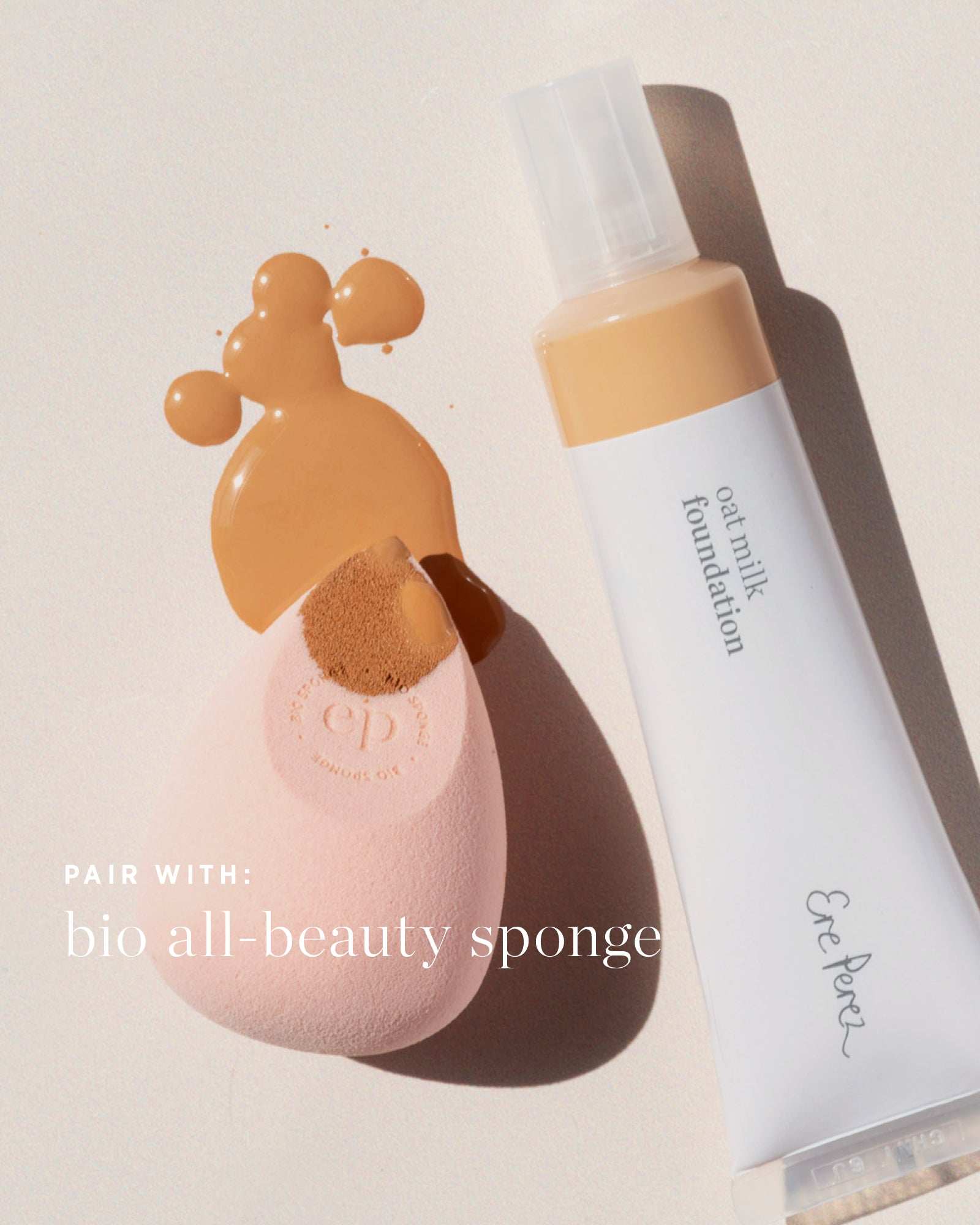 Foundation bottle and pink sponge with &