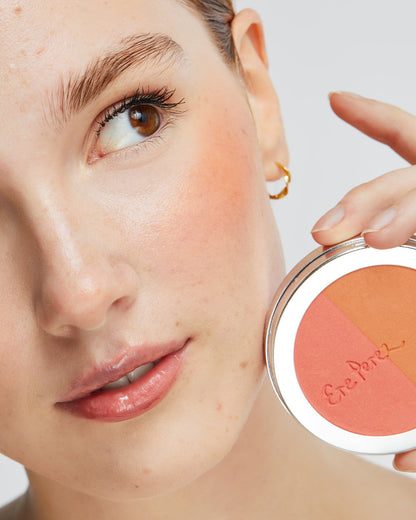 Natural refill of rice powder blush by Ere Perez in its wheel and applied on the skin for a refreshed look