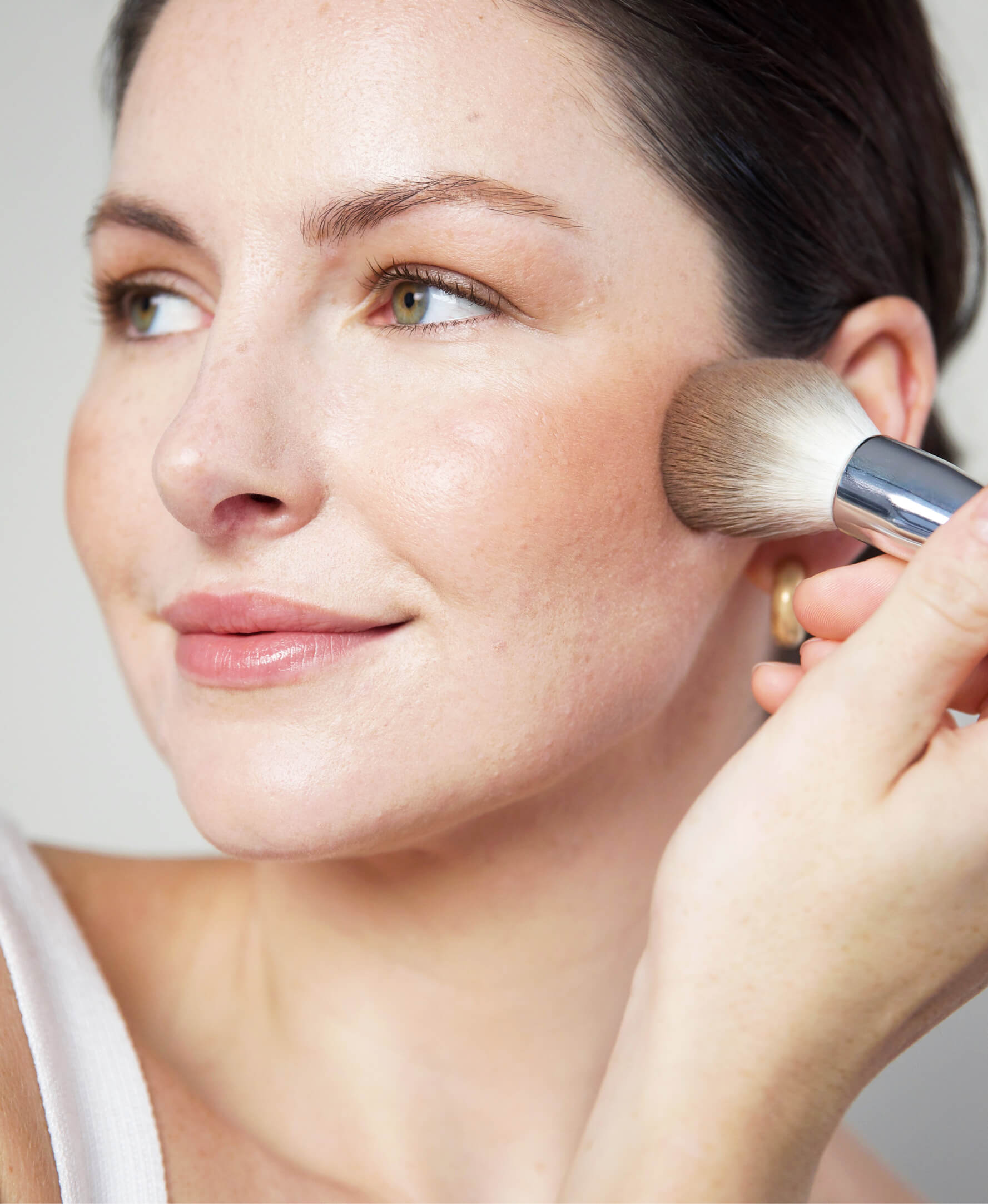 All-natural rice powder blush & bronzer by Ere Perez applied for radiant skin