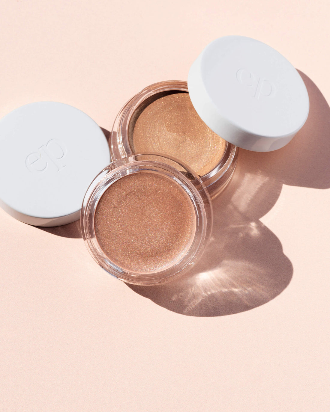 Pots of Ere Perez all-natural vanilla highlighter in 2 different shades, with plastic free packaging