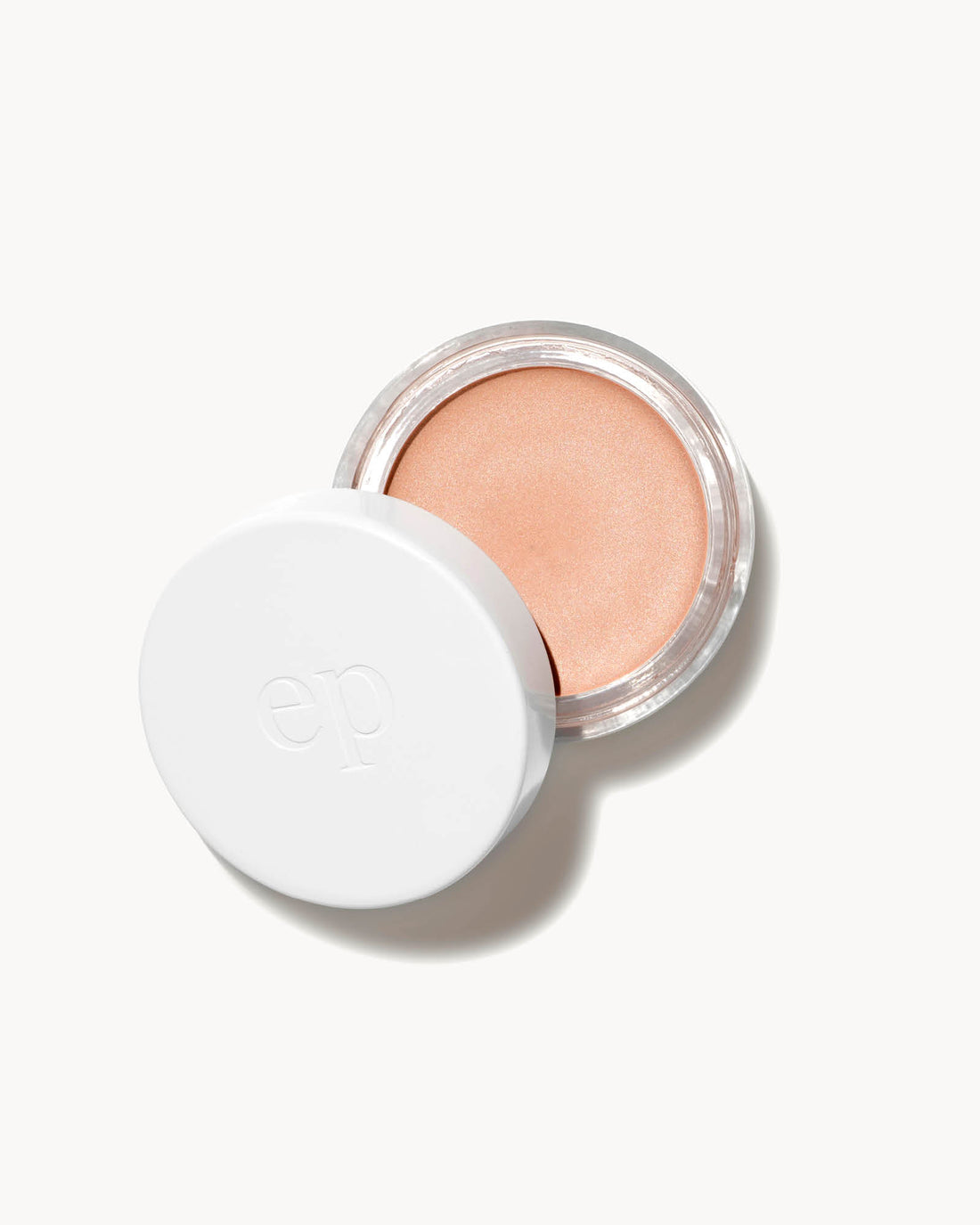 vanilla highlighter a white lid on a light beige background