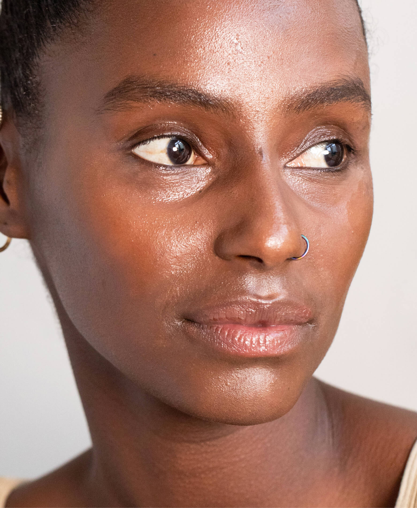 Nourishing organic arnica all-cover concealer applied on skin