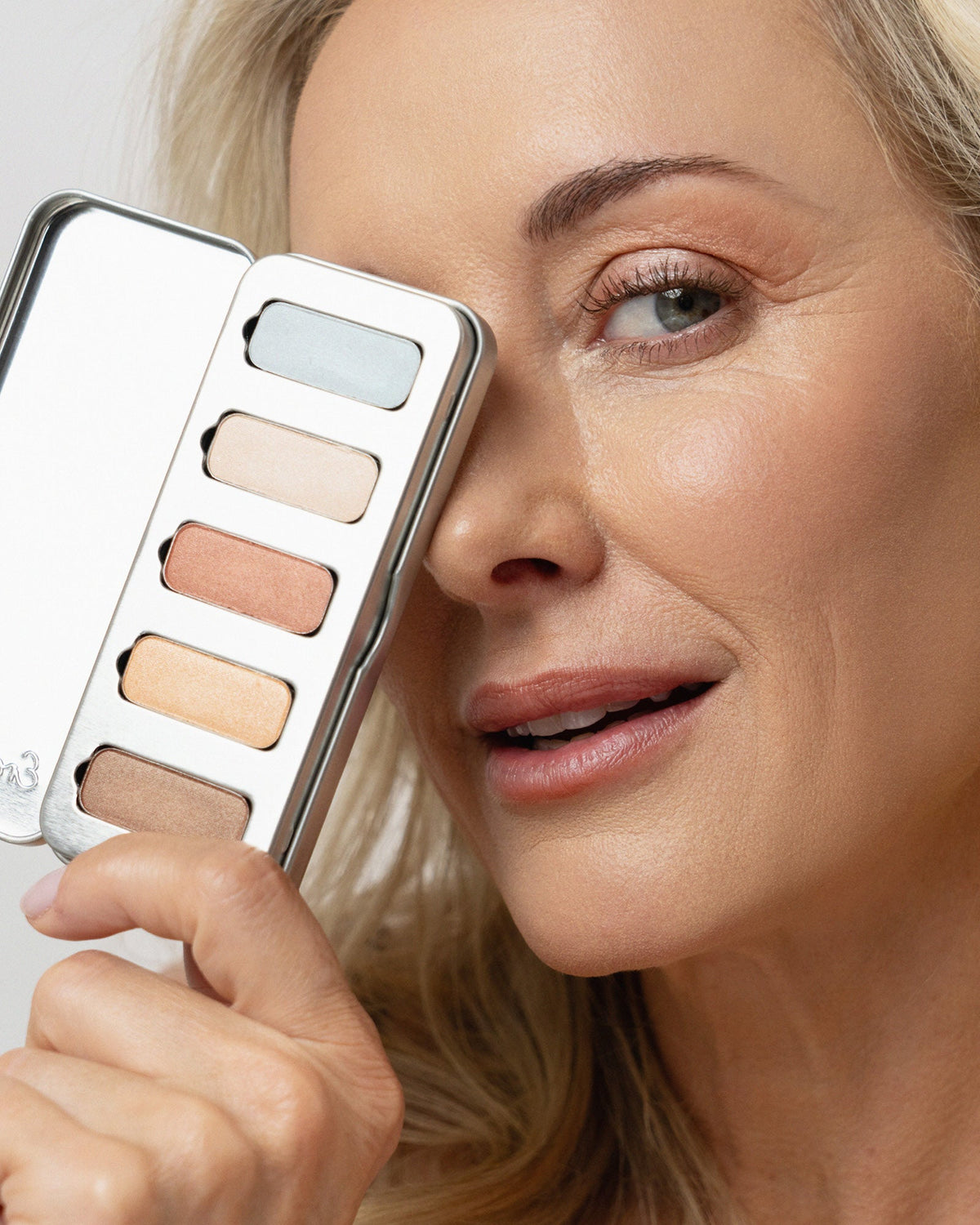 Blonde model wearing luminous Light Shimmer Chamomile eyeshadow.