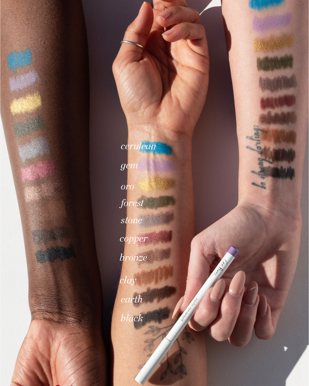 multiple swatches of different shades of organic jojoba eye pencil applied on the different skin tones