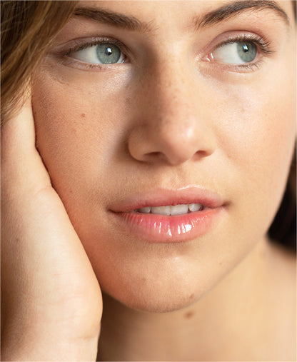 clear organic mango lip honey by Ere Perez applied on the lips for a hydrating gloss