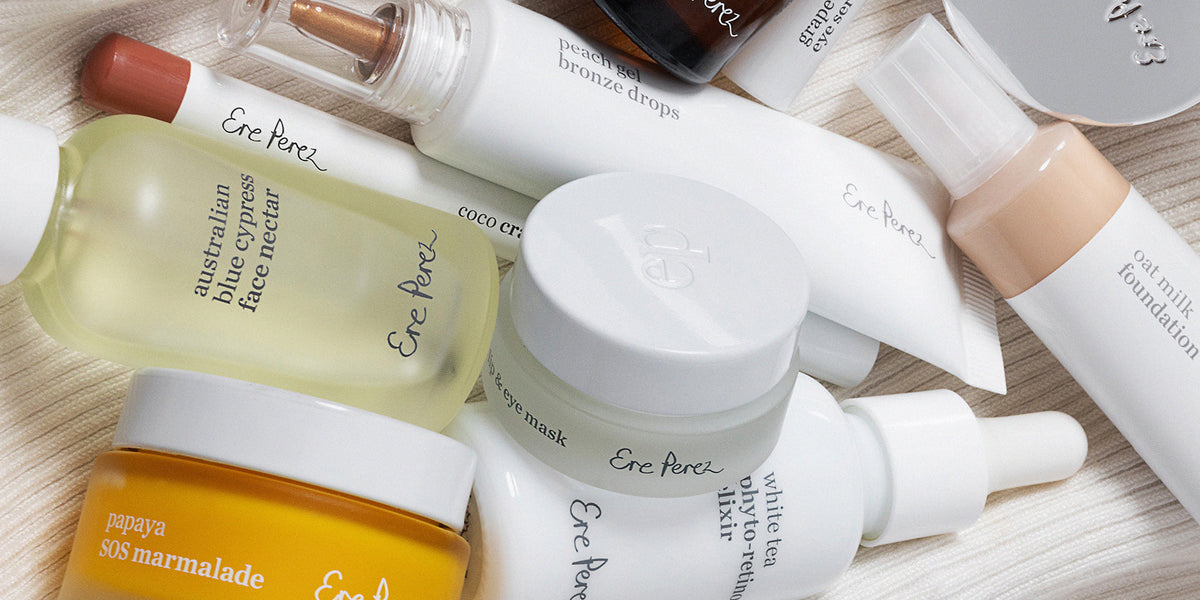 Ere Perez skincare and makeup products arranged together, including Australian Blue Cypress Face Nectar, Oat Milk Foundation and White Tea Phyto-Retinol Elixir.