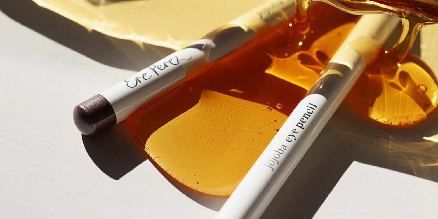 Ere Perez Jojoba eye pencil with jojoba oil in the background