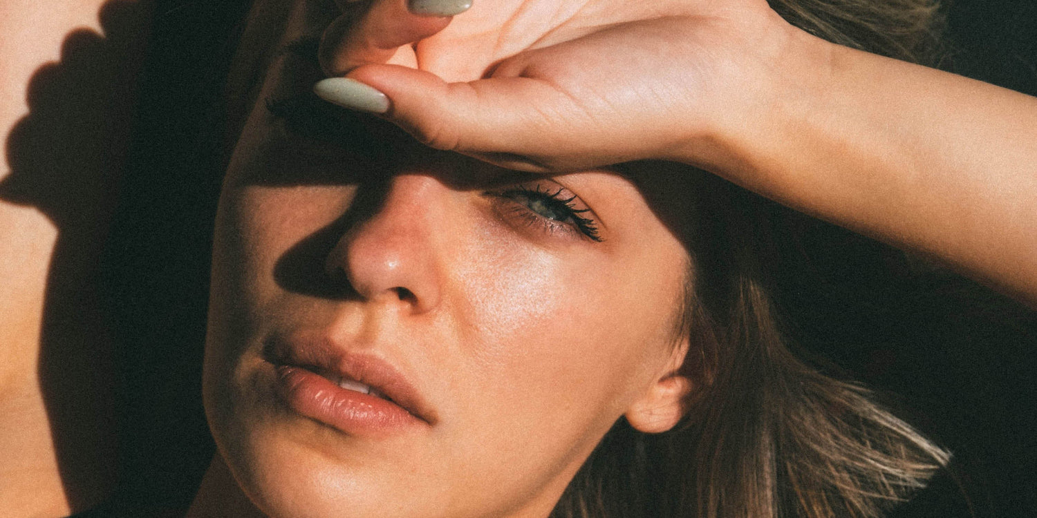 model wearing ere perez products in sunlight.