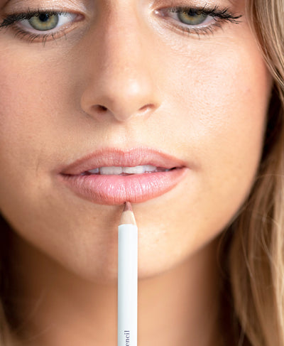 eco-friendly açai lip liner by Ere Perez in its pencil and applied to gently define and hydrate sensitive lips 