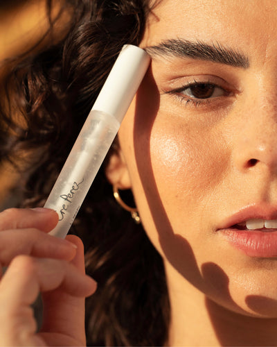 Natural aloe gel lash &amp; brow mascara by Ere Perez in bottle and applied on brows and lashes for natural long-lasting hold