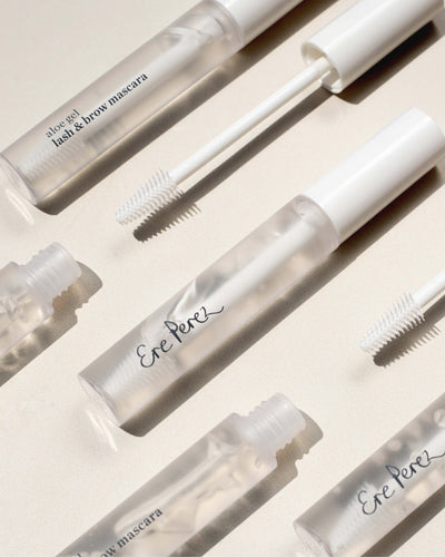 multiple bottles of aloe gel lash &amp; brow mascaras by Ere Perez in their recyclable packaging 