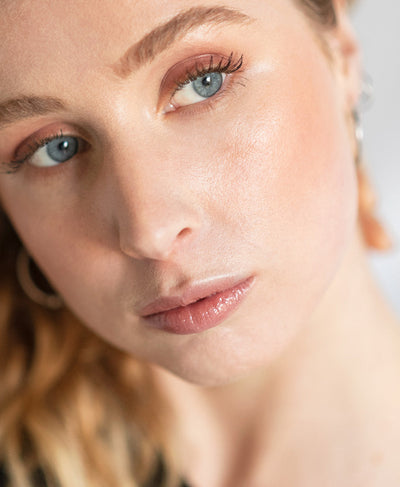 Organic &amp; delicate arnica all-cover concealer applied on skin for clear complexion 