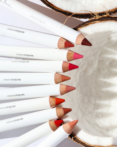 gentle moisturising coco crayon by Ere Perez applied on skin and in its waste-free crayon for a natural long-lasting colour   