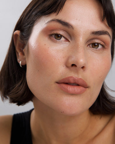 gentle moisturising coco crayon by Ere Perez applied on skin and in its waste-free crayon for a natural long-lasting colour   