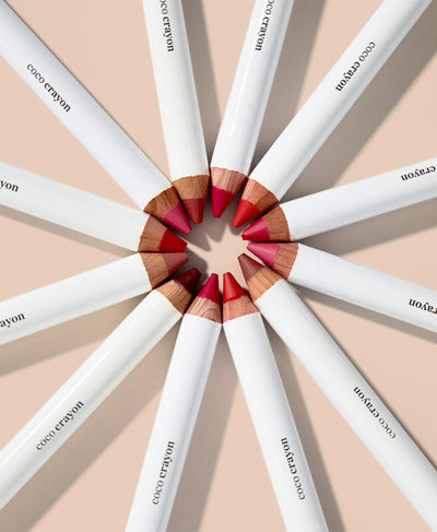 multiple shades of organic coco crayons in their plastic-free packaging by Ere Perez  