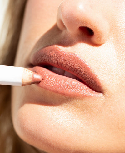 gentle hydrating coco crayon by Ere Perez applied on lips and in its waste-free crayon for a healthy plump look  