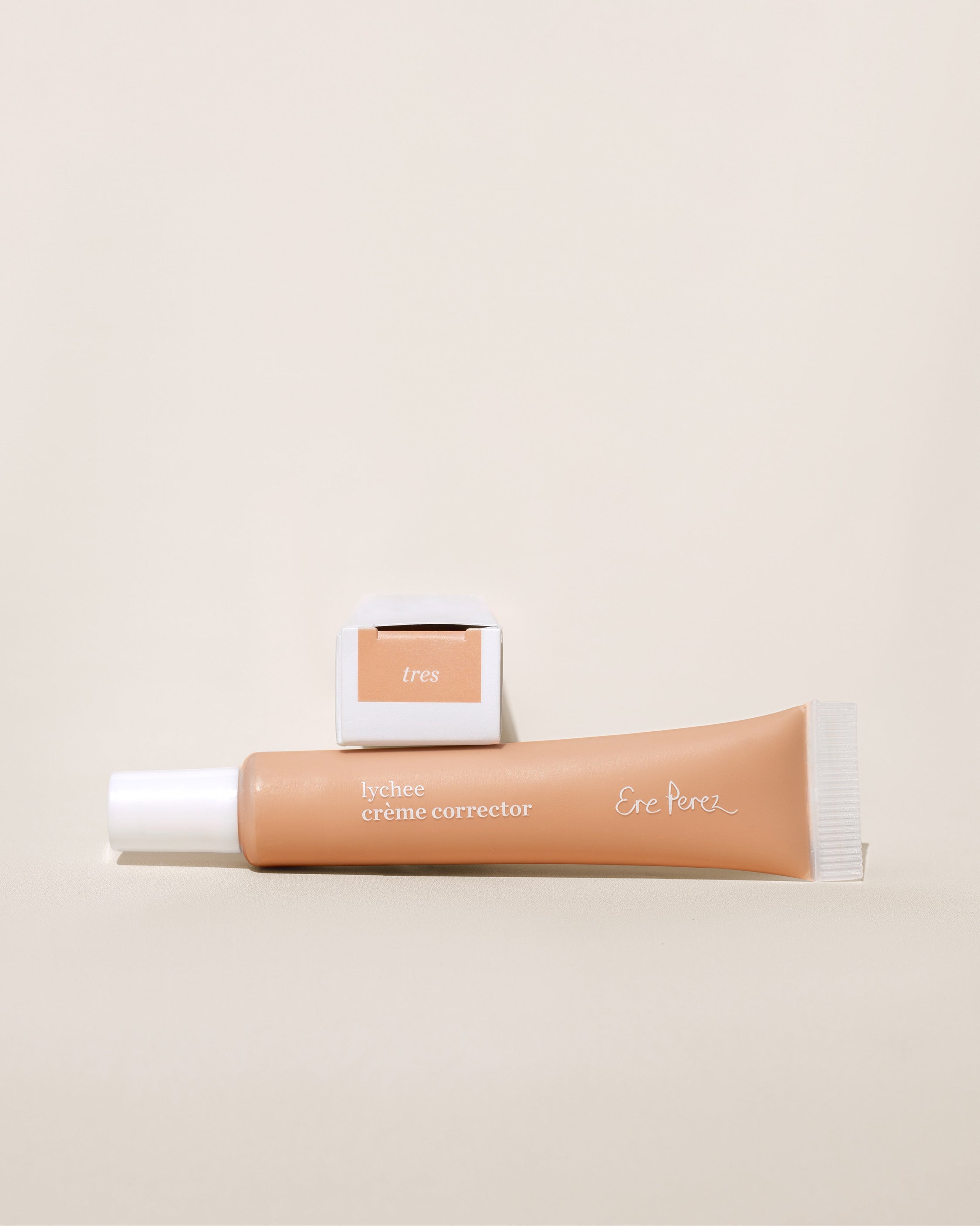 Natural lychee creme corrector bottle &amp; box for even &amp; moisturised skin by Ere Perez  